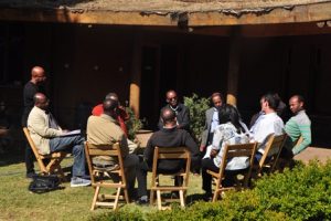 Stakeholder workshop participants sit outside and discuss ideas to build urban resilience in Addis Ababa